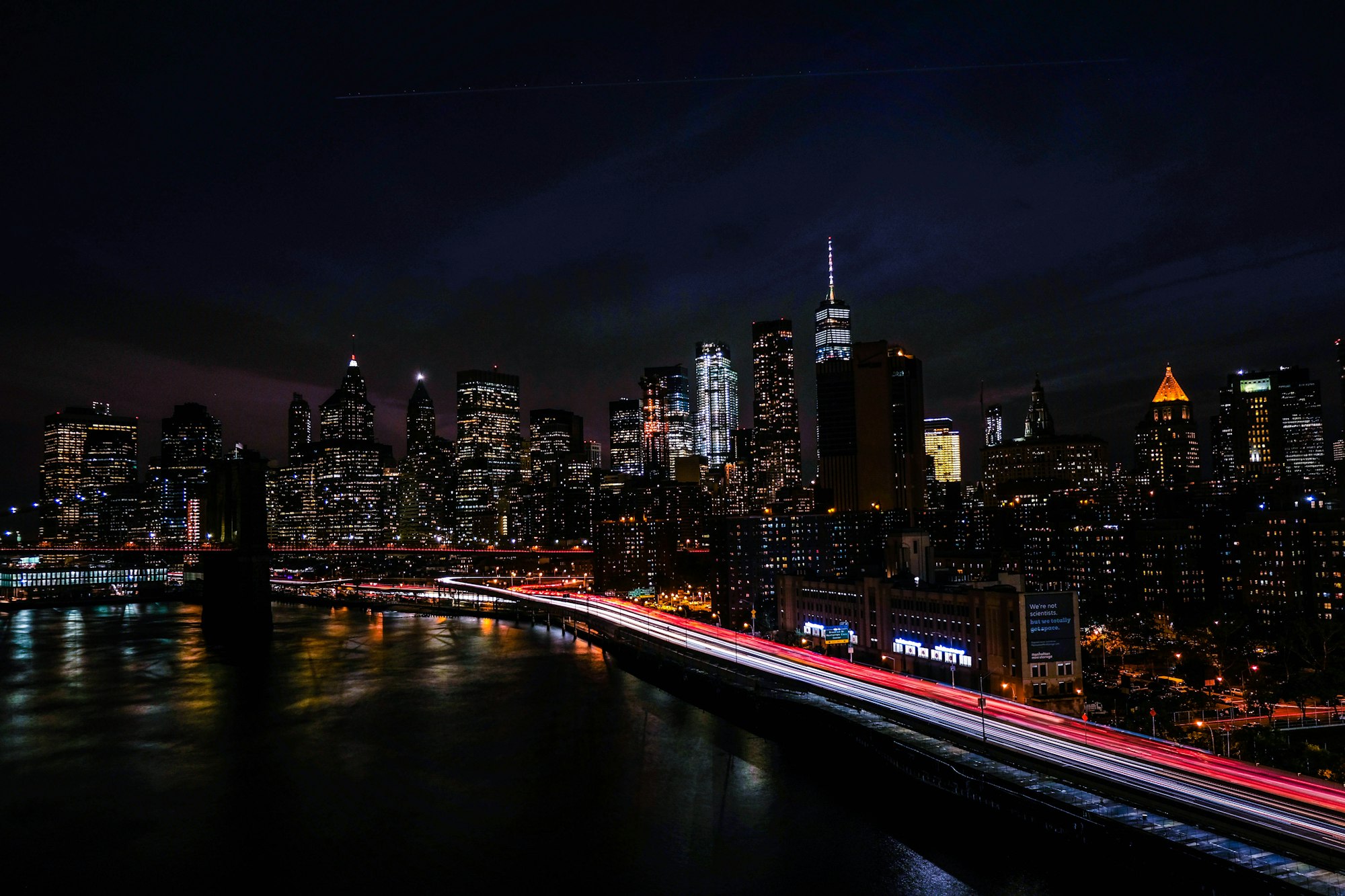 New York skyline at night with light trails on the highway